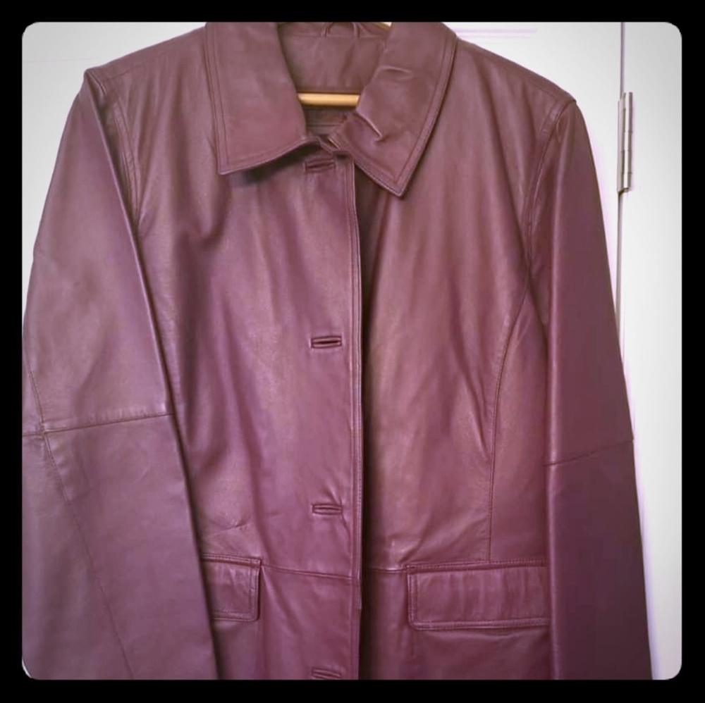Plum color leather jacket. Never worn. No tags